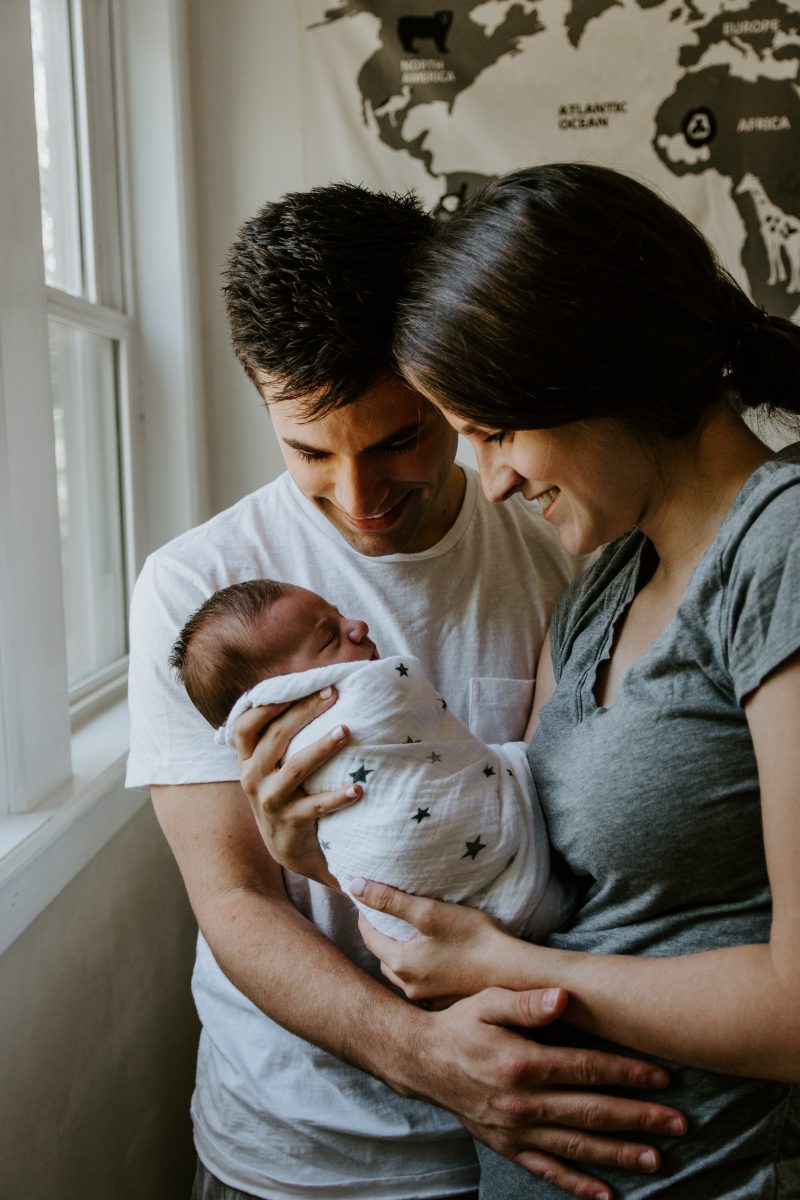 Parents holding their newborn
